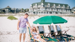 man & woman on beach chairs